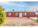 Newly painted red house with a small front yard at 8055 S 7Th St, Phoenix, AZ 85042