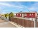 Red single story house with gated entrance at 8055 S 7Th St, Phoenix, AZ 85042