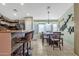 Bright dining area featuring a stylish light fixture and a window offering natural light at 8219 W Globe Ave, Phoenix, AZ 85043