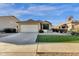 Inviting one-story home with manicured landscaping, artificial turf and a well-maintained exterior at 8219 W Globe Ave, Phoenix, AZ 85043