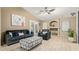 Inviting living room with a vaulted ceiling, tile flooring, and a comfortable seating area at 8219 W Globe Ave, Phoenix, AZ 85043