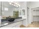 Elegant bathroom boasting granite countertops and a large mirror at 8270 N Hayden Rd # 1023, Scottsdale, AZ 85258