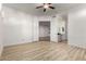 Bright bedroom with wood-look floors and ceiling fan at 8270 N Hayden Rd # 1023, Scottsdale, AZ 85258