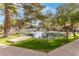 Quaint community pond with a wooden dock at 8270 N Hayden Rd # 1023, Scottsdale, AZ 85258