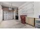 Garage with shelving, storage, and overhead door at 8270 N Hayden Rd # 1023, Scottsdale, AZ 85258