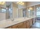 Bathroom with double sinks and a large mirror at 11029 W Mountain View Dr, Avondale, AZ 85323