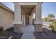 Front entrance with covered porch and stone accents at 11029 W Mountain View Dr, Avondale, AZ 85323