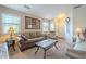 Living room with neutral colored couch and coffee table at 11029 W Mountain View Dr, Avondale, AZ 85323