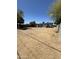 Large backyard with dirt and sparse vegetation at 11713 W River Rd, El Mirage, AZ 85335