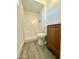 Clean bathroom with shower, toilet and wood-look floor at 11713 W River Rd, El Mirage, AZ 85335