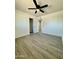 Bright bedroom with ceiling fan and laminate wood floor at 11713 W River Rd, El Mirage, AZ 85335