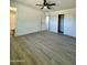 Spacious bedroom with ensuite bathroom and laminate flooring at 11713 W River Rd, El Mirage, AZ 85335