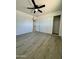 Spacious bedroom with new flooring and a closet at 11713 W River Rd, El Mirage, AZ 85335