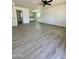 Bright and airy living area with modern flooring at 11713 W River Rd, El Mirage, AZ 85335