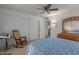 Bright bedroom with double closets and rocking chair at 12506 W Castle Rock Dr, Sun City West, AZ 85375