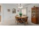 Charming dining room with wood table and hutch at 12506 W Castle Rock Dr, Sun City West, AZ 85375