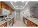 Efficient kitchen featuring ample counter space and wood cabinets at 12506 W Castle Rock Dr, Sun City West, AZ 85375