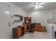 Laundry room with desk, washer, and dryer at 12506 W Castle Rock Dr, Sun City West, AZ 85375