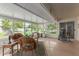 Sunroom with wicker furniture and view of backyard at 12506 W Castle Rock Dr, Sun City West, AZ 85375