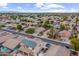 Aerial view of a suburban neighborhood with houses and tree-lined streets at 12522 W Llano Dr, Litchfield Park, AZ 85340