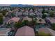 Aerial view of a beautiful neighborhood with a focus on a single-Gathering home with a pool at 12522 W Llano Dr, Litchfield Park, AZ 85340