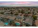 Aerial view of home and neighborhood at sunset at 12522 W Llano Dr, Litchfield Park, AZ 85340