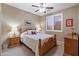 Charming bedroom with wood furniture and plantation shutters at 12522 W Llano Dr, Litchfield Park, AZ 85340