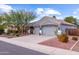 Two-story house with a three-car garage and desert landscaping at 12522 W Llano Dr, Litchfield Park, AZ 85340