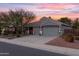 Two-story home with a three-car garage and landscaped yard at 12522 W Llano Dr, Litchfield Park, AZ 85340