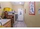 Laundry room with washer, dryer, and utility sink at 12522 W Llano Dr, Litchfield Park, AZ 85340