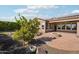 Landscaped backyard with fire pit and spacious patio at 12911 W Eagle Ridge Ln, Peoria, AZ 85383