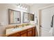 Double vanity bathroom with modern light fixtures and neutral color palette at 12911 W Eagle Ridge Ln, Peoria, AZ 85383