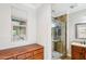 Updated bathroom with a walk-in shower and wood vanity at 12911 W Eagle Ridge Ln, Peoria, AZ 85383