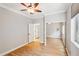 Bright bedroom featuring wood floors and mirrored closet at 12911 W Eagle Ridge Ln, Peoria, AZ 85383