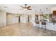 Open concept dining area with tile floors and ceiling fan at 12911 W Eagle Ridge Ln, Peoria, AZ 85383