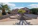 Single-story home with circular walkway and palm trees at 12911 W Eagle Ridge Ln, Peoria, AZ 85383