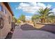 Brick paved patio with gate access and desert landscaping at 12911 W Eagle Ridge Ln, Peoria, AZ 85383