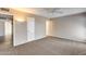 Neutral bedroom with a ceiling fan, carpet, and doors leading to the hallway and bathroom at 13219 W Prospect Dr, Sun City West, AZ 85375