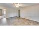 Neutral bedroom with tile flooring and a ceiling fan, ready for personalization and comfortable living at 13219 W Prospect Dr, Sun City West, AZ 85375