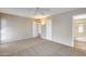 Neutral bedroom with a ceiling fan, carpet, and doors leading to the hallway and bathroom at 13219 W Prospect Dr, Sun City West, AZ 85375