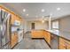 Kitchen showcasing stainless steel appliances, tile flooring, and open concept layout at 13219 W Prospect Dr, Sun City West, AZ 85375