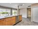 Kitchen area featuring a stainless steel dishwasher, undermount sink, and views to the backyard at 13219 W Prospect Dr, Sun City West, AZ 85375