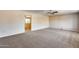 Spacious living room featuring neutral walls and carpet at 13219 W Prospect Dr, Sun City West, AZ 85375