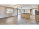 Expansive living area with tile flooring offers bright natural light and seamless flow to the kitchen and outdoor space at 13219 W Prospect Dr, Sun City West, AZ 85375