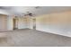 Spacious living room featuring neutral walls and carpet at 13219 W Prospect Dr, Sun City West, AZ 85375