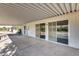 Covered patio with access from a door and sliding glass doors, creating an indoor-outdoor flow at 13219 W Prospect Dr, Sun City West, AZ 85375