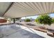 Covered patio with concrete floor, and view of the backyard with lush landscaping at 13219 W Prospect Dr, Sun City West, AZ 85375