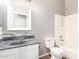 Bathroom with granite countertop and white cabinets at 13257 W Watson Ln, Surprise, AZ 85379