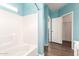 Clean bathroom with a tub and light blue walls at 13257 W Watson Ln, Surprise, AZ 85379