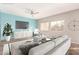 Virtually staged living room with light walls, wood-look floors, and a neutral sofa at 13257 W Watson Ln, Surprise, AZ 85379